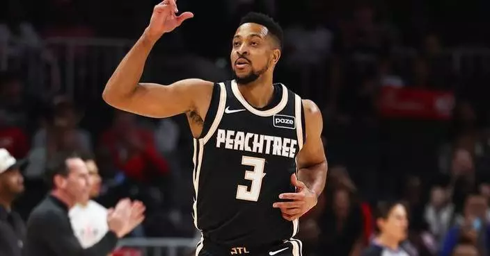 Hawks clinch a playoff spot and Southeast Division behind 29 points from McCollum in rout of Cavs