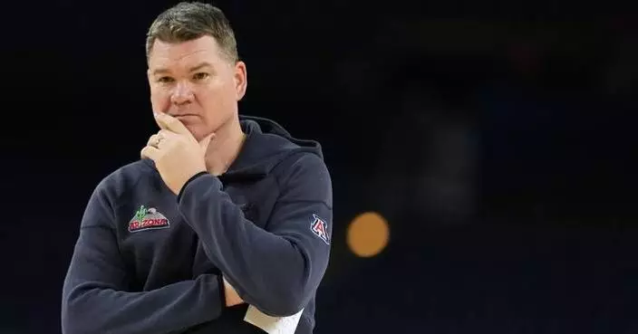 Arizona coach stays and Michigan awaits the Wildcats for heavyweight game at a distracted Final Four