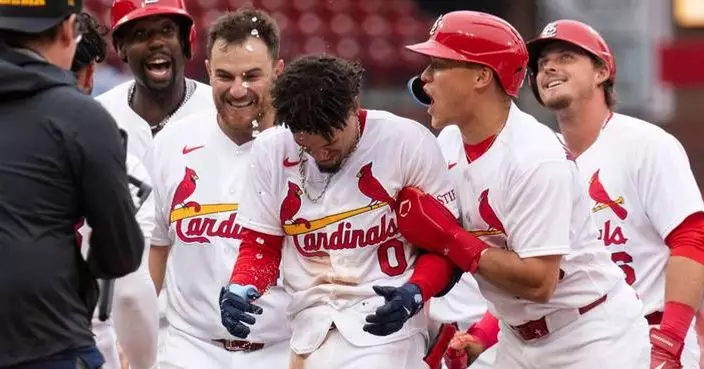 Winn’s bloop single lifts Cardinals to 2-1 victory over slumping Mets in 11 innings