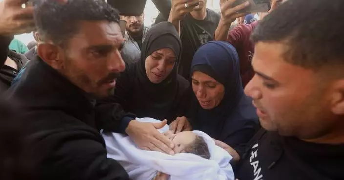 Palestinians hold funerals for pregnant woman and her children killed in Israeli strikes