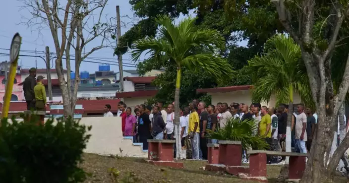 Photos of freed prisoners reuniting with families outside a Cuban prison