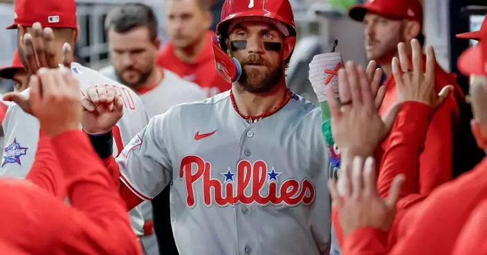 Bryce Harper leads Phillies past Braves 8-5 in 10 innings to stop 10-game losing streak