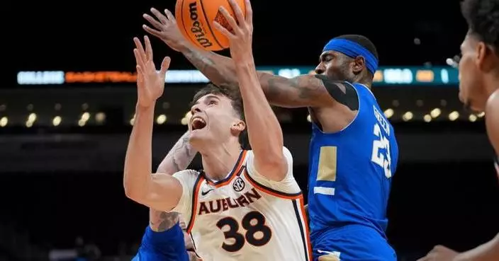 Overton, Pettiford help Auburn beat Tulsa 92-86 in OT for 1st NIT championship