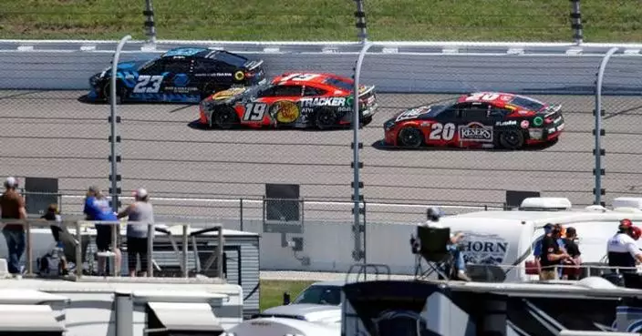 Tyler Reddick passes Kyle Larson on the final lap of OT to win NASCAR Cup Series race at Kansas