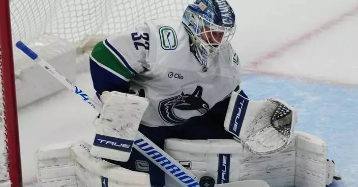 Boeser has hat trick, last-place Canucks overcome blowing 4-goal lead to beat NHL-leading Avs