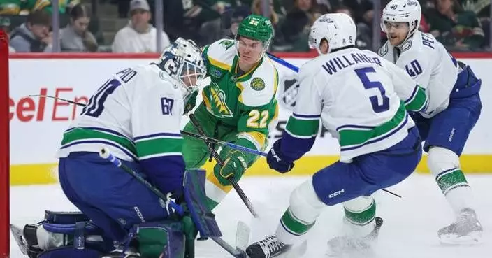 Wild wrap up a playoff spot with 5-2 victory over the Canucks