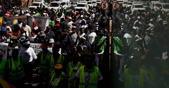 Hundreds march in Johannesburg against illegal migration as shops shut over looting fears