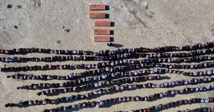 A Syrian man buries his wife and 4 children killed in Israeli strikes on Beirut