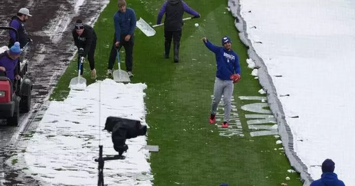 Surprise mid-April snow coats Coors Field as Dodgers-Rockies series gets off to frosty start