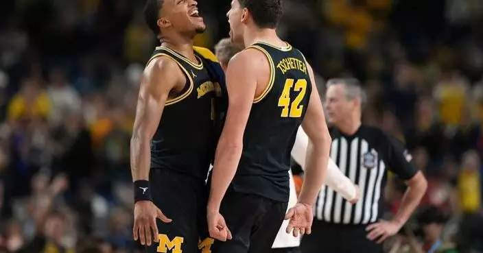 Michigan overpowers Arizona and reaches national title game with 91-73 win