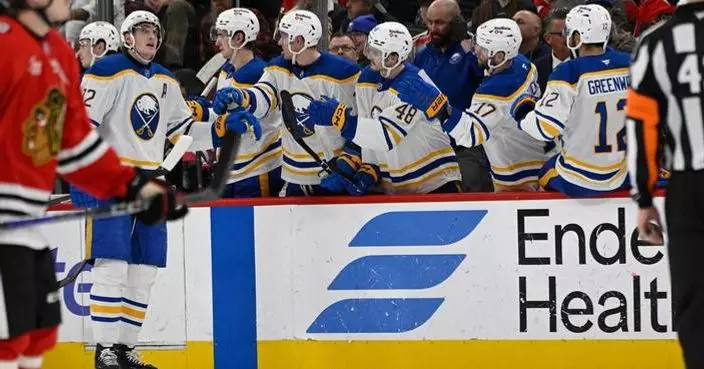 Thompson stars as Sabres clinch Atlantic title with a 5-1 victory over Blackhawks