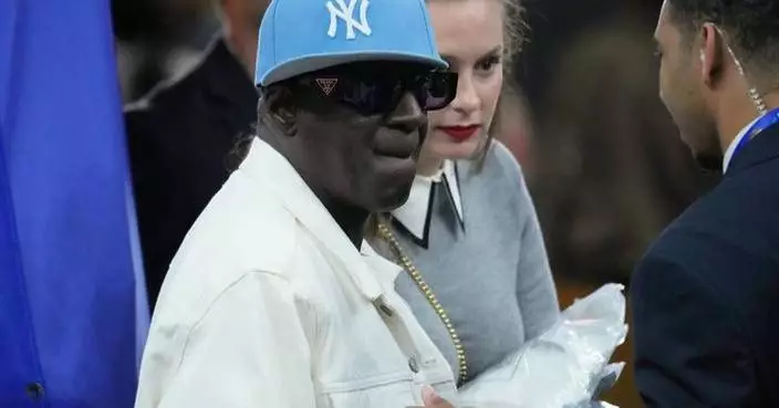 Flavor Flav, a longtime supporter of women’s sports, is courtside at Final Four
