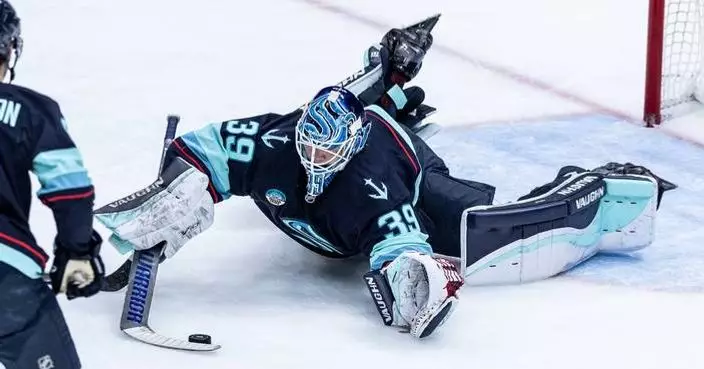 Kokko attempts goalie goal in 1st NHL start, stops 26 shots as Kraken beat Flames 4-1