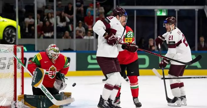 Latvia routs Hungary 8-1 to reach quarterfinals at ice hockey worlds