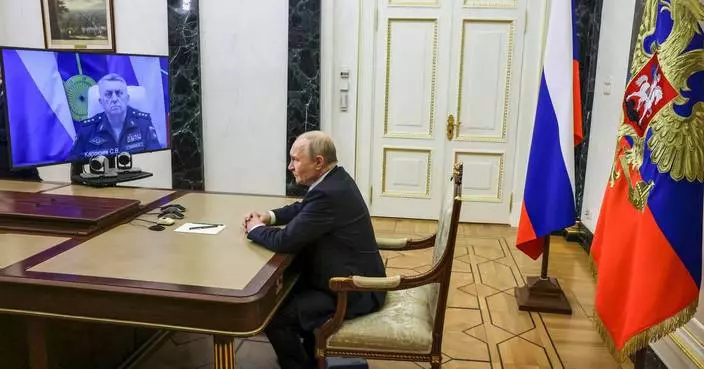Putin hails Russia’s test launch of a new ballistic missile and calls it the world’s most powerful