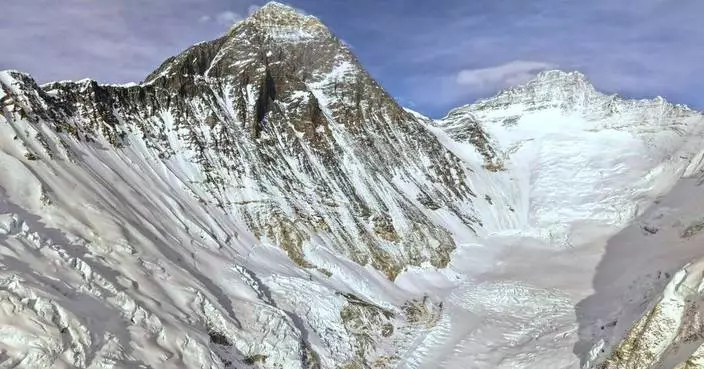 Photos show climbers attempting to scale Mount Everest despite increasing challenges