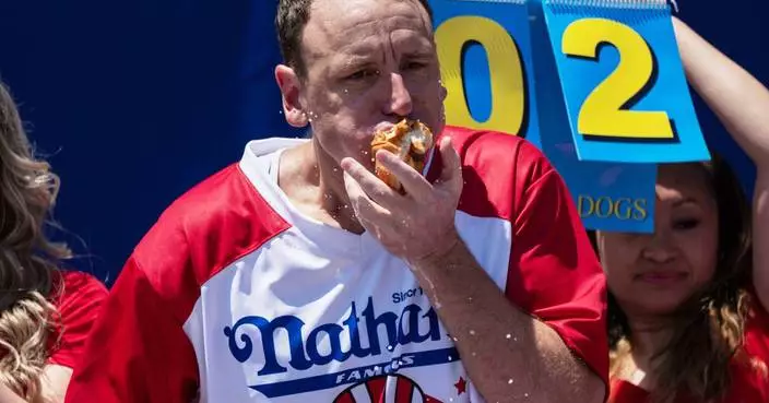 Joey Chestnut to defend hot dog eating title while on probation after pleading guilty to battery