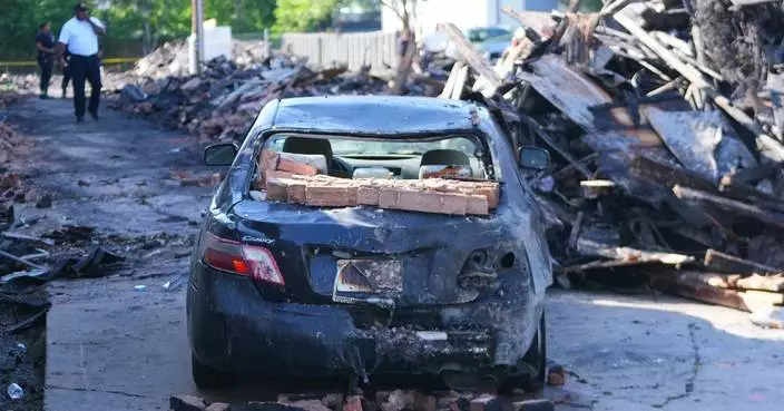 Crews scour the site of a deadly Dallas apartment blast and fire searching for more possible victims