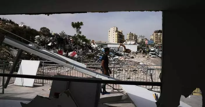Israeli bulldozers raze about 50 Palestinian shops ahead of settlement-linked road project