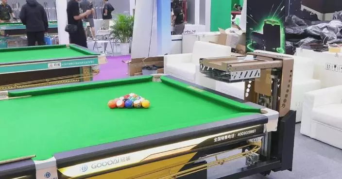 Smart billiard table capable of assembling balls in 18 seconds showcased at exhibition