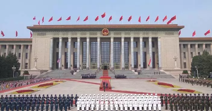 Xi, Trump greeted by Chinese Honor Guard, children waving flags at welcome ceremony
