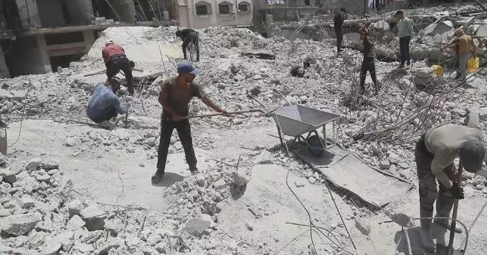 Gaza residents clear rubble by hand as large-scale reconstruction stalls