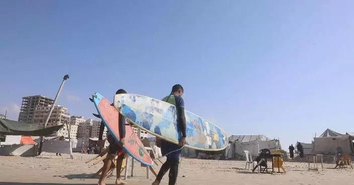 Surfers in war-torn Gaza find rare moments of joy by taking to waves
