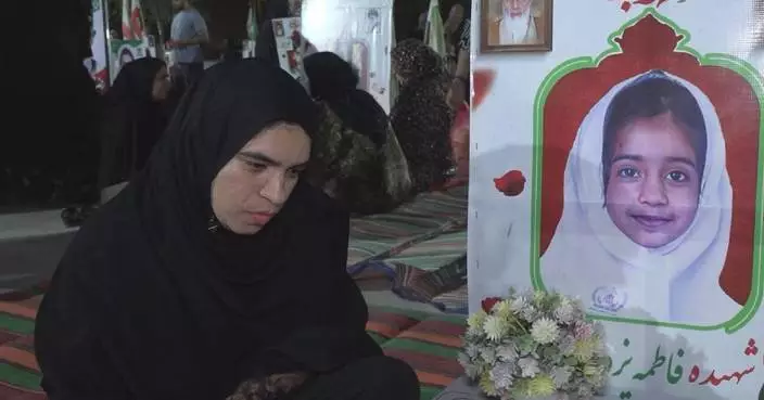 Grief lingers at cemetery where Iranian schoolgirls killed in missile strike are buried