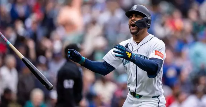 Woo strikes out 9 in 6 scoreless innings as Mariners beat Braves 3-1