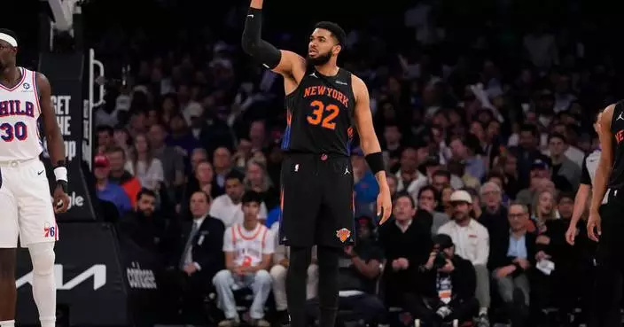 Glass cleaner: Karl-Anthony Towns dislodges ball behind backboard after Andre Drummond can’t