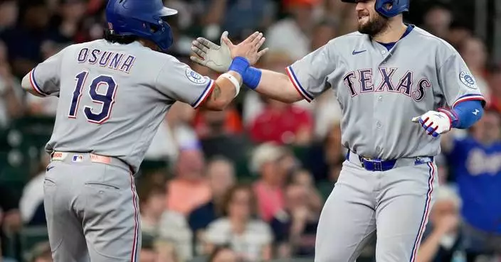 Burger blasts a homer, drives in 4 as Eovaldi powers the Rangers past the Astros 8-0