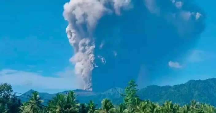 Indonesian rescuers find 1 body after volcano eruption as search continues for 2 more