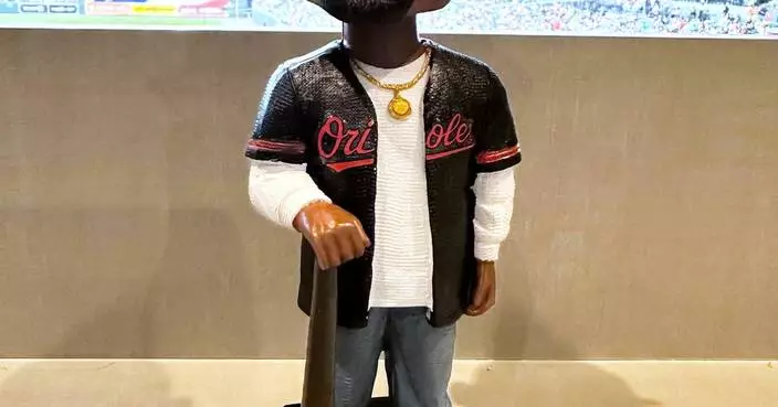 Orioles hold Tupac Skakur bobblehead promotion, and his sister throws out the ceremonial first pitch