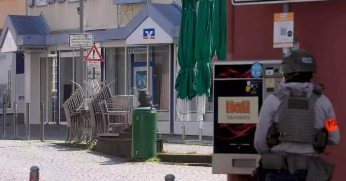 Police free 2 people after hostage alarm at German bank but find no perpetrators