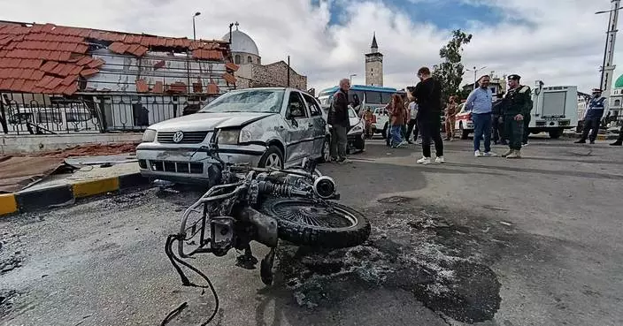 Blast outside a Syrian defense ministry building kills a soldier, wounds 12 people