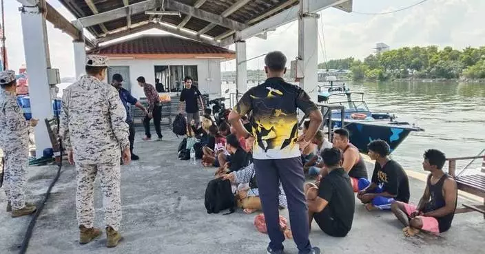 Malaysia searches for 14 missing Indonesians after a migrant boat sinks