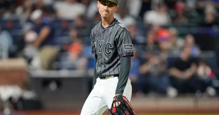 Weaver’s fib: Tells injured Holmes he had name written in cap because `it just felt right to say’