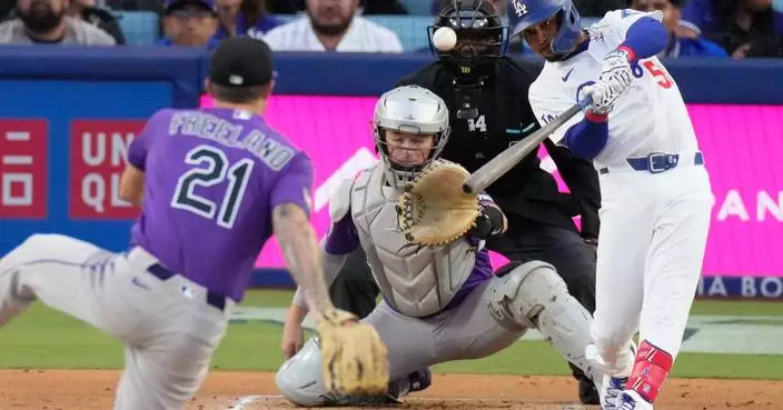 Betts blasts 2 homers and drives in 5 as the Dodgers crush the Rockies 15-6