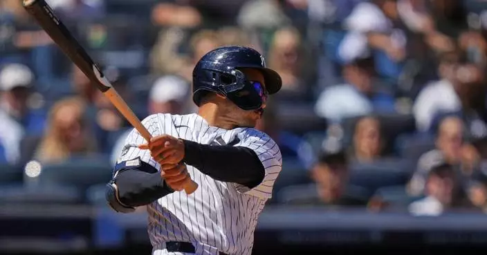 Grisham leads Yankees over Rangers 9-2 for 16th win in 19 games but Domínguez hurt hitting wall