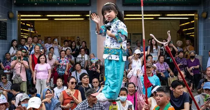 Revelers pack a Hong Kong island for a bun festival, a century-old tradition