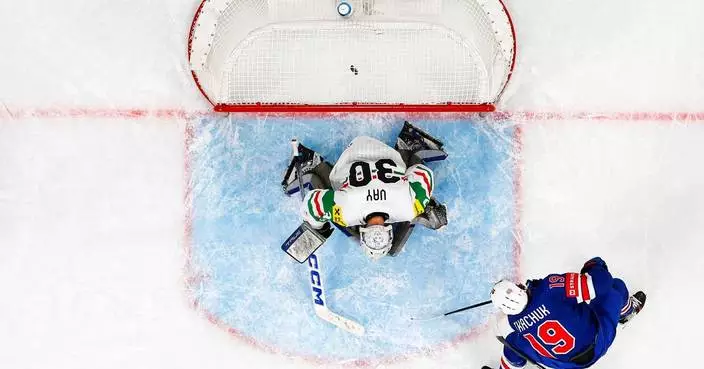 US beats Hungary to stay alive for ice hockey world quarterfinals