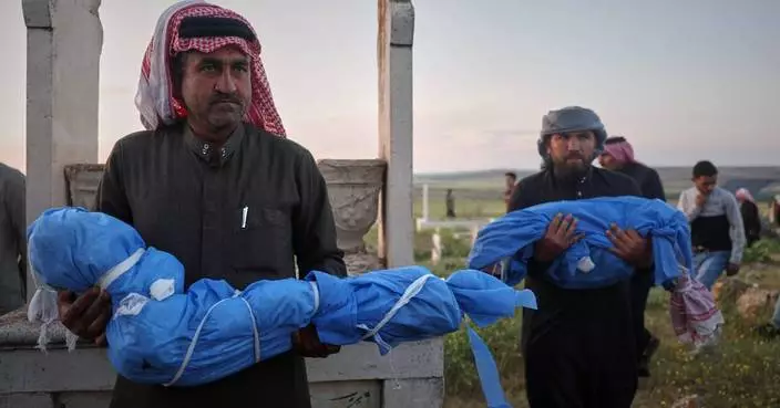 A grieving father buries his 6-year-old after a land mine kills 3 children in Syria’s Idlib