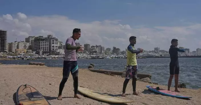 Surfers in war-torn Gaza find rare moments of joy taking to the waves
