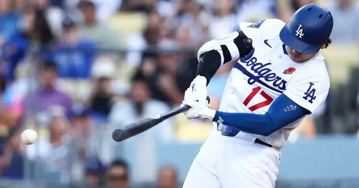 Freddie Freeman sparks a 4-run seventh as the Dodgers rally past the Rockies 5-3