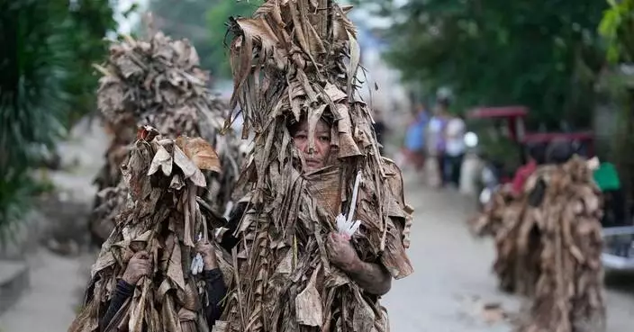 Philippine devotees honor St. John the Baptist with a mud-covered display of faith