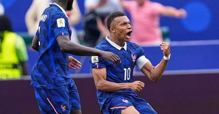Kylian Mbappé scores 2 goals to lead France to 3-0 win over Iraq and into World Cup knockout stage