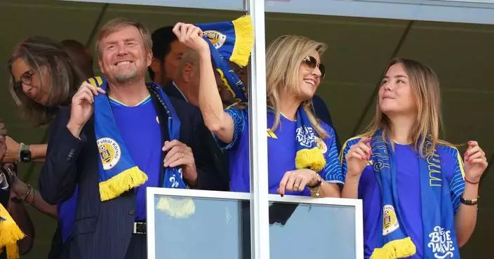 Dutch royals swap orange for blue as they cheer for the Netherlands, then Curaçao at the World Cup
