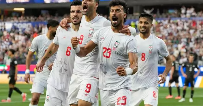 Iran opens its politically charged World Cup by playing to a 2-2 draw with New Zealand