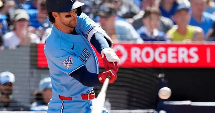 Toronto's Clement dodges tag from Baltimore's Henderson and is ruled safe, angering Orioles in loss