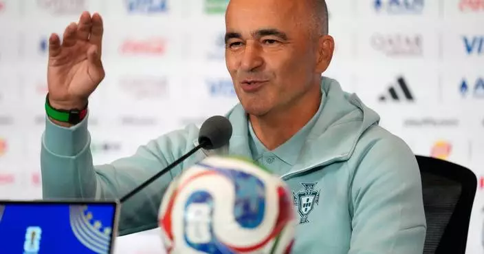 The sounds of Dua Lipa interrupt Portugal coach Roberto Martínez's World Cup news conference